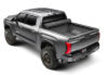 Black truck with red stripe featuring bak 2022+ toyota tundra 5.5ft bed revolver x4s bed cover
