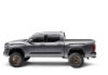 Toy truck with white background next to bak 2022+ toyota tundra 5.5ft revolver x4s bed cover