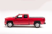Red truck parked on white surface - bak 2023+ chevy colorado crew cab 5.2ft bed bakflip mx4 matte finish