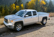 Silver chevy colorado crew cab truck parked on dirt road in bakflip f1 product