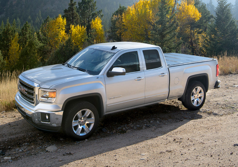 Silver chevy colorado crew cab truck parked on dirt road in bakflip f1 product