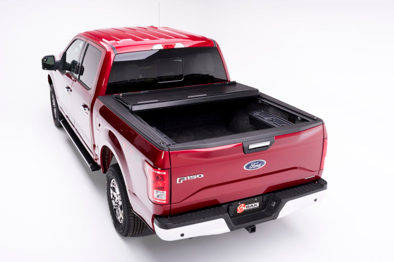 Red truck with black bed cover - bakflip f1 5.7ft bed cover for 21-22 ford f-150 (incl