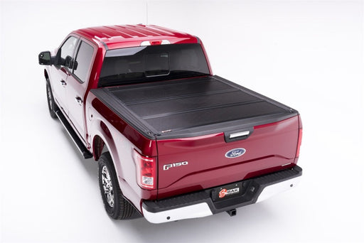 Red truck with black bed cover - bak 21-22 ford f-150 bakflip f1 5.7ft bed cover