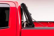 Red chevrolet silverado 1500 truck with door open by bakflip mx4