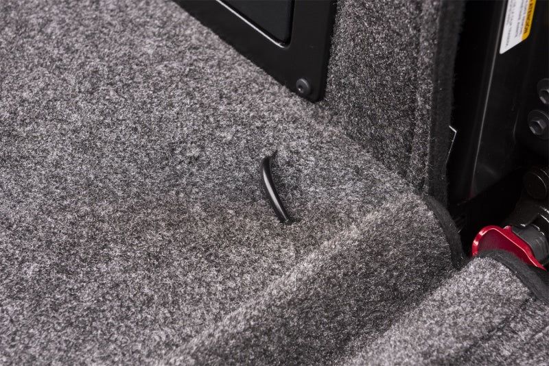 Interior of a car with door open - bedrug toyota tacoma bedliner