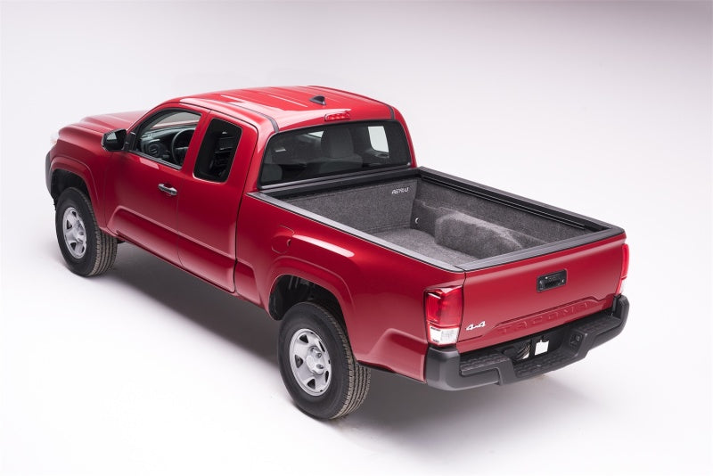 Red truck with black bed cover - bedrug bedliner for toyota tacoma installation instructions
