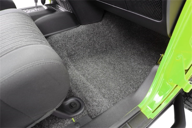 Interior of a jeep wrangler with green seat from bedrug 3pc floor kit
