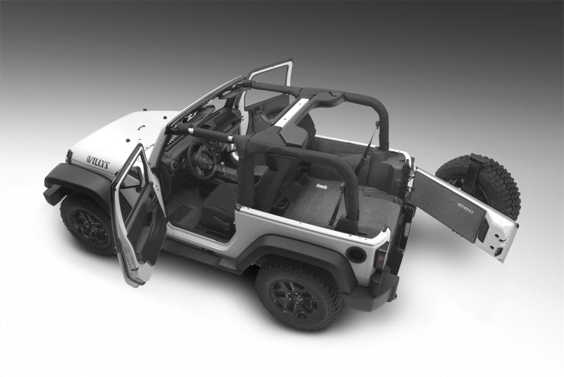 Close up of jeep jk 2dr with door open and steering wheel, part of bedrug cargo kit