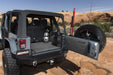 Jeep wrangler parked on rocky trail - bedrug cargo kit on ford bronco