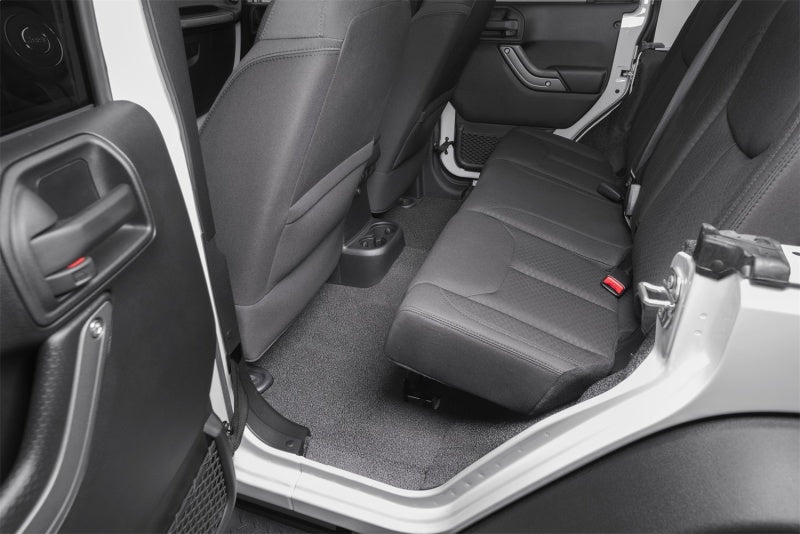 Interior of a jeep wrangler with bedrug bedtred floor kit