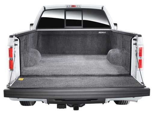 Bedrug 08-16 ford superduty 6.5ft short bed with factory step gate bedliner - white truck with open trunk