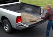 Man loading a truck bed with a shovel - bedrug 09-18 dodge ram 5.7ft bed w/rambox bed storage bedliner
