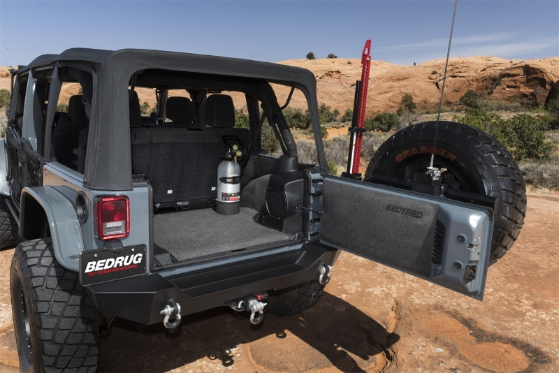 Jeep parked on rocky trail - bedrug bedtred cargo kit for jeep wrangler