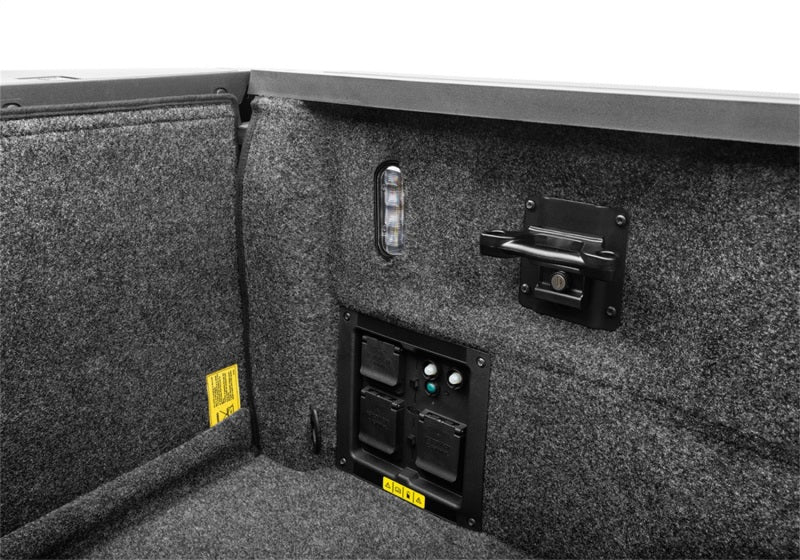 Bedrug 15-23 ford f-150 5.5ft bed bedliner installation instructions on truck bed with open door