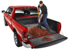 Man loading wood chips into ford f-150 truck bed