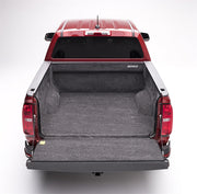 Red truck with open trunk - bedrug 17-23 chevrolet colorado bedliner