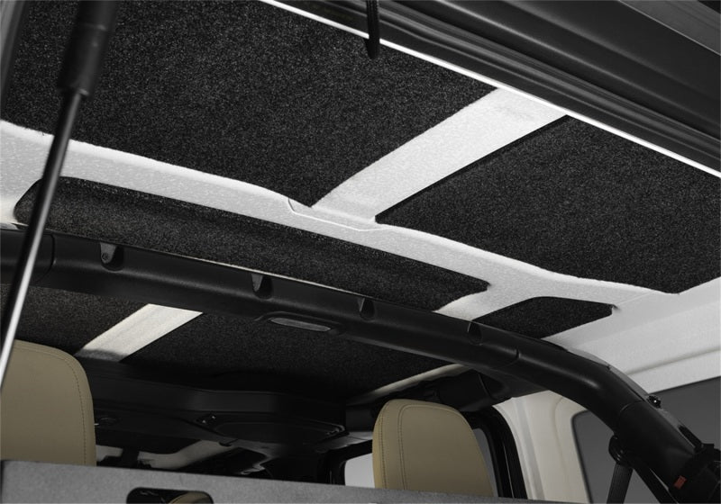 Interior of jeep wrangler jl 2-door with black and white carpet headliner