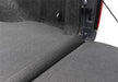 Ford f-150 5.5ft bed impact bedliner with folded back seat in truck