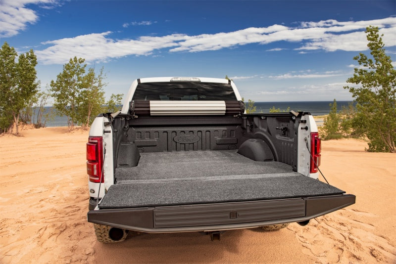 White truck with open bed featuring bedrug 2015+ ford f-150 5ft 5in bed xlt mat and hook & loop system
