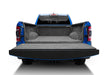 Blue truck with open trunk compartment bedrug 2019+ dodge ram bedliner