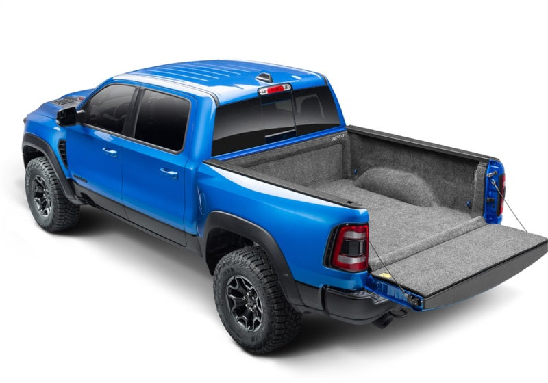 Bedrug 2019+ dodge ram 6.4ft bed bedliner with truck bed displayed in the back