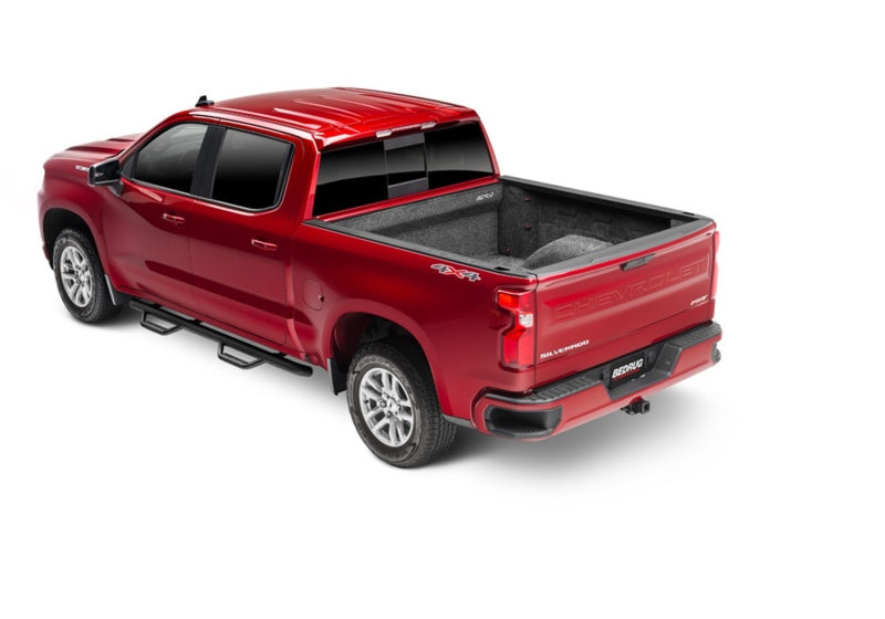 Rear view of a red truck with bedrug bedliner installed for gm silverado/sierra 1500