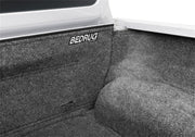 Bedrug 22-23 toyota nissan frontier/navara 5ft bed bedliner in white pickup truck’s back seat