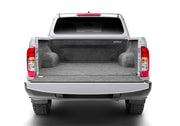 Silver truck with open trunk, bedrug 22-23 toyota nissan frontier/navara 5ft bed bedliner