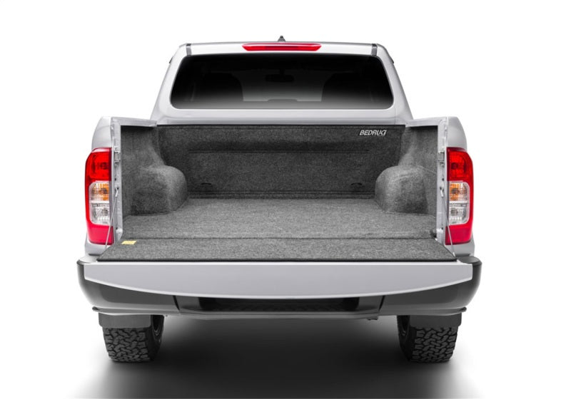 Silver truck with open trunk, bedrug 22-23 toyota nissan frontier/navara 5ft bed bedliner