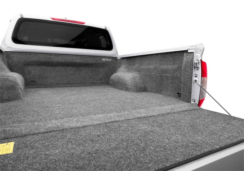 White truck with folded bed - bedrug 22-23 toyota nissan frontier/navara 5ft bed bedliner
