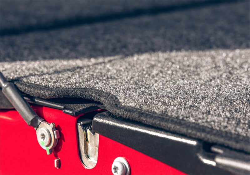 Red and black roof with black roofing membrane on bedrug 22-23 toyota tundra 5ft 6in bed bedliner