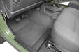 Interior of a vehicle with door open - bedrug 97-06 jeep tj front 3pc bedtred floor kit w/center console