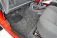 Interior of jeep tj with open door, bedrug front floor kit w/center console, heat shields