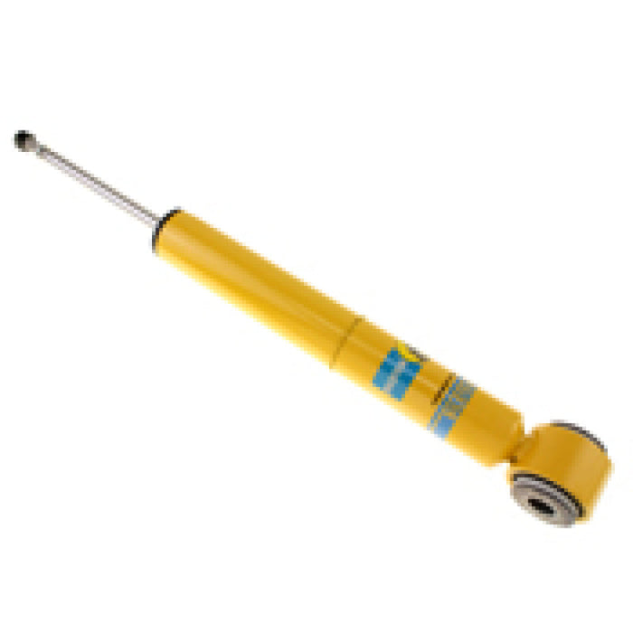 Yellow plastic medical syringe with metal handle on bilstein shock absorber