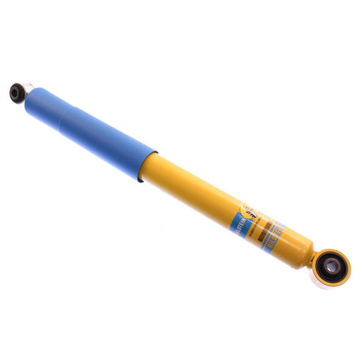 Bilstein 4600 series shock absorber in blue and yellow cylinder on white background