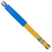 Blue and yellow pen with black tip on bilstein 4600 series shock absorber