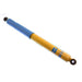 Blue and yellow pen with black tip, displayed with bilstein 4600 series shock absorber