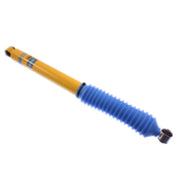 Bilstein 4600 series rear shock absorber with blue and yellow spring on white background