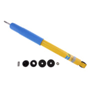 Blue and yellow pen with a black ball on top of bilstein 4600 series 2014 dodge ram 2500 rear 46mm monotube shock