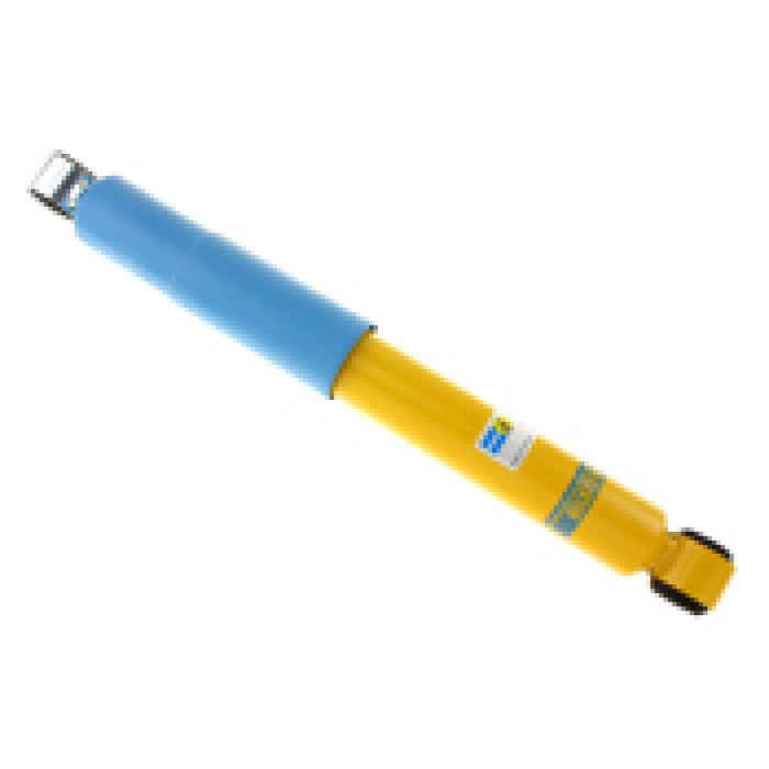 Blue and yellow cylinder shock absorber on white background - bilstein 4600 series isuzu trooper rear shock absorber