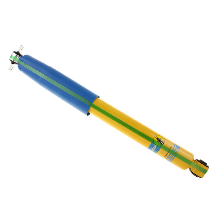 Yellow and blue pen with black tip on bilstein b6 2003 chevrolet blazer zr2 rear shock absorber