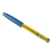 Yellow and blue pen with black tip on bilstein b6 2003 chevrolet blazer zr2 rear shock absorber