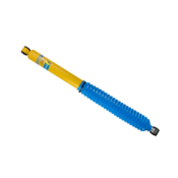 Blue and yellow plastic ballpoint pen with black tip on bilstein b6 4600 series shock absorber