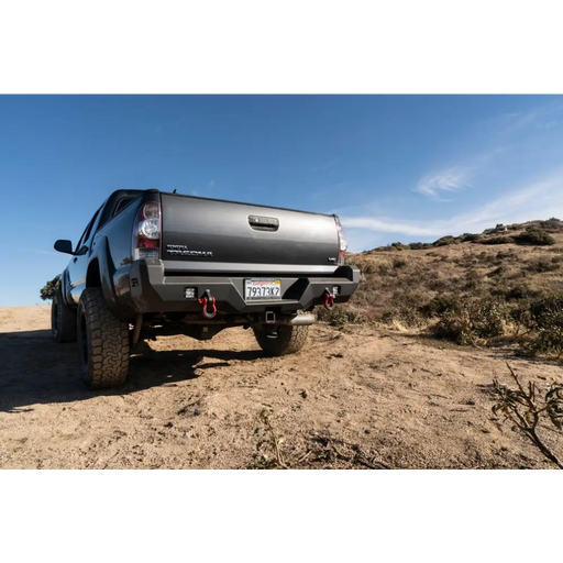 Toyota Tacoma Pro Series Rear Bumper on dirt road truck.