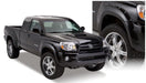 Black truck with pocket style fender flares for toyota tacoma, white background