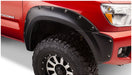 Red toyota tacoma truck with black fender flares - bushwacker pocket style 4pc set