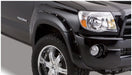 Black truck with chrome rim, toyota tacoma fender flares - bushwacker pocket style 4pc bed