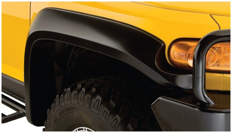 Yellow toyota fj cruiser with bushwacker black flares