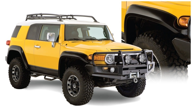 Yellow toyota fj cruiser with black bumper - bushwacker extend-a-fender style flares - black