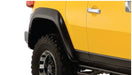 Yellow truck with black tire cover - bushwacker extend-a-fender style flares for toyota fj cruiser